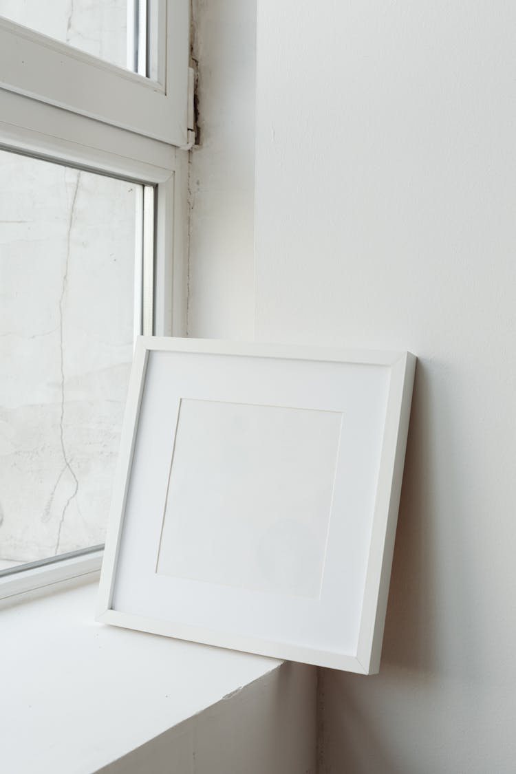 White Wooden Frame Near The Window