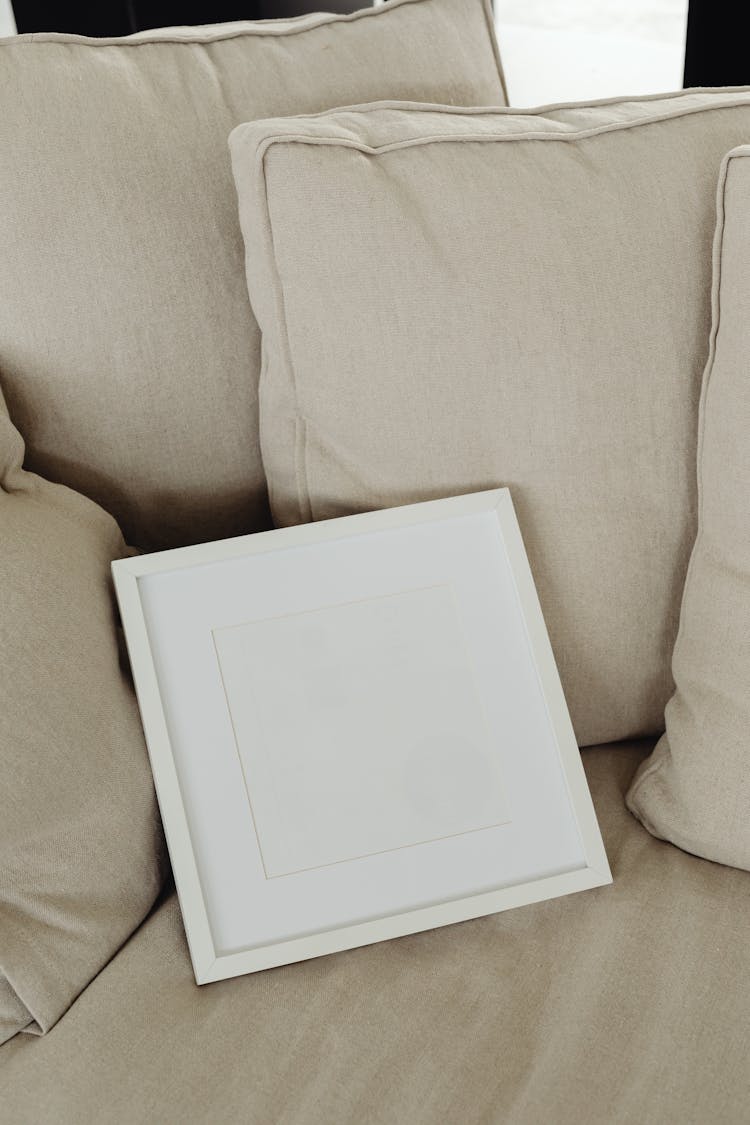 An Empty Frame On A Couch