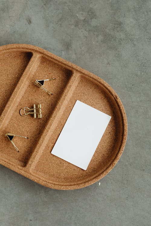 Close-Up Shot of an Empty Card beside Paper Clips