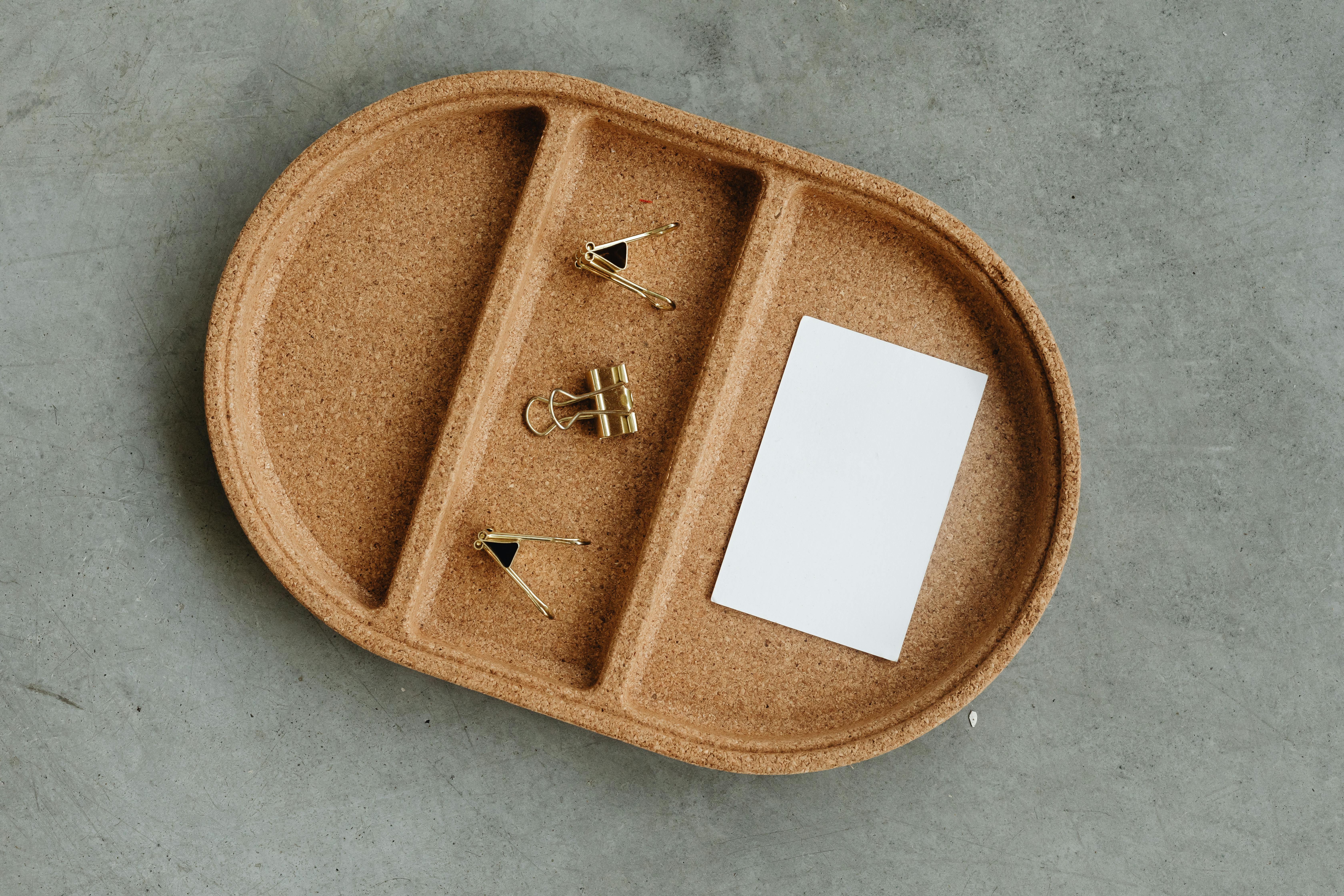 An Empty Business Card beside Paper Clips