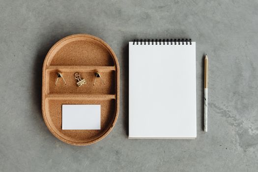 White Notebook Beside Black Pen