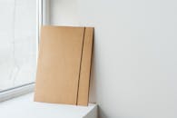 Close-Up Shot of a Cardboard Folder