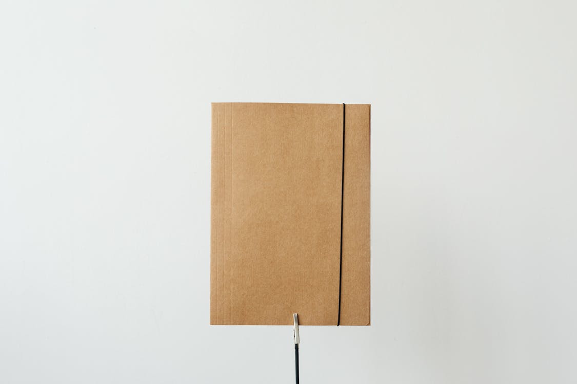 A Cardboard Folder on a White Surface