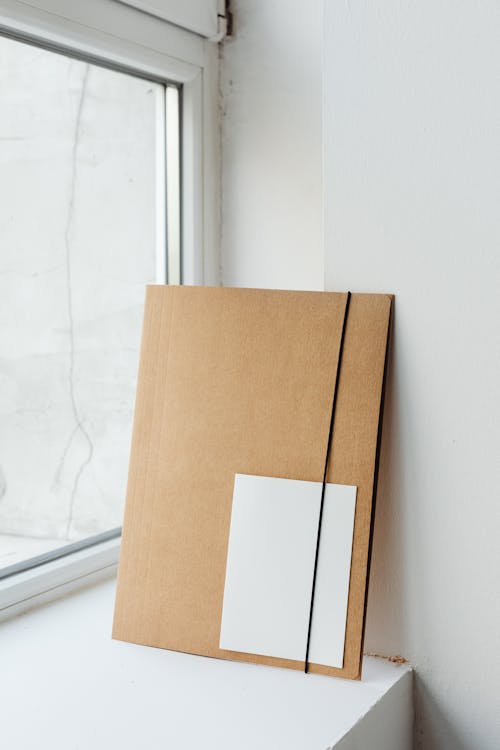 Cardboard Folder on a Windowsill