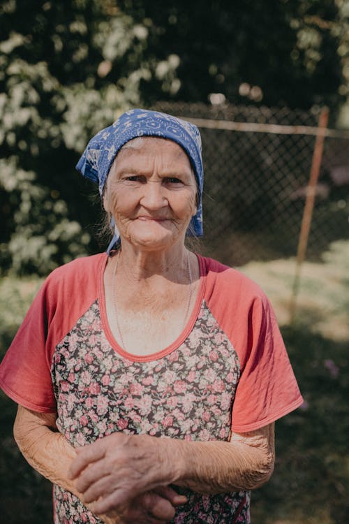 Cute Elderly Woman Wearing a Headscarf · Free Stock Photo