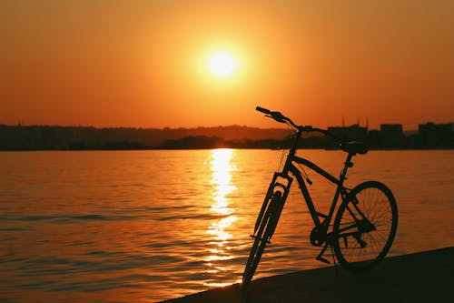 Bicycle by River at Golden Hour