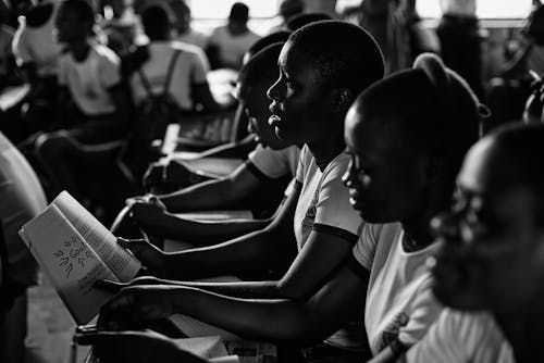 Monochrome Photograph of Students Studying