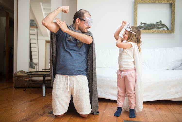 Father And Daughter Playing Together