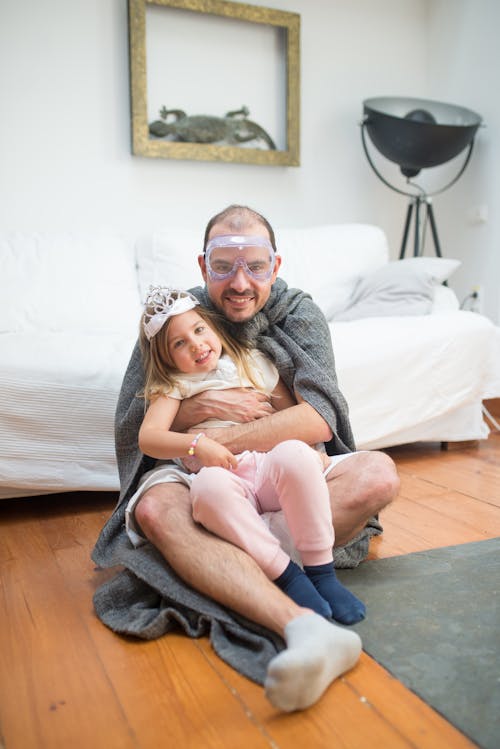 Free Father and Daughter Sitting on the Floor Stock Photo