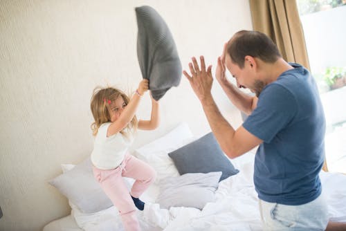 Girl Doing Pillow Fight with a Man