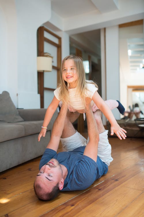 Free Father and Daughter Playing in the Livingroom Stock Photo