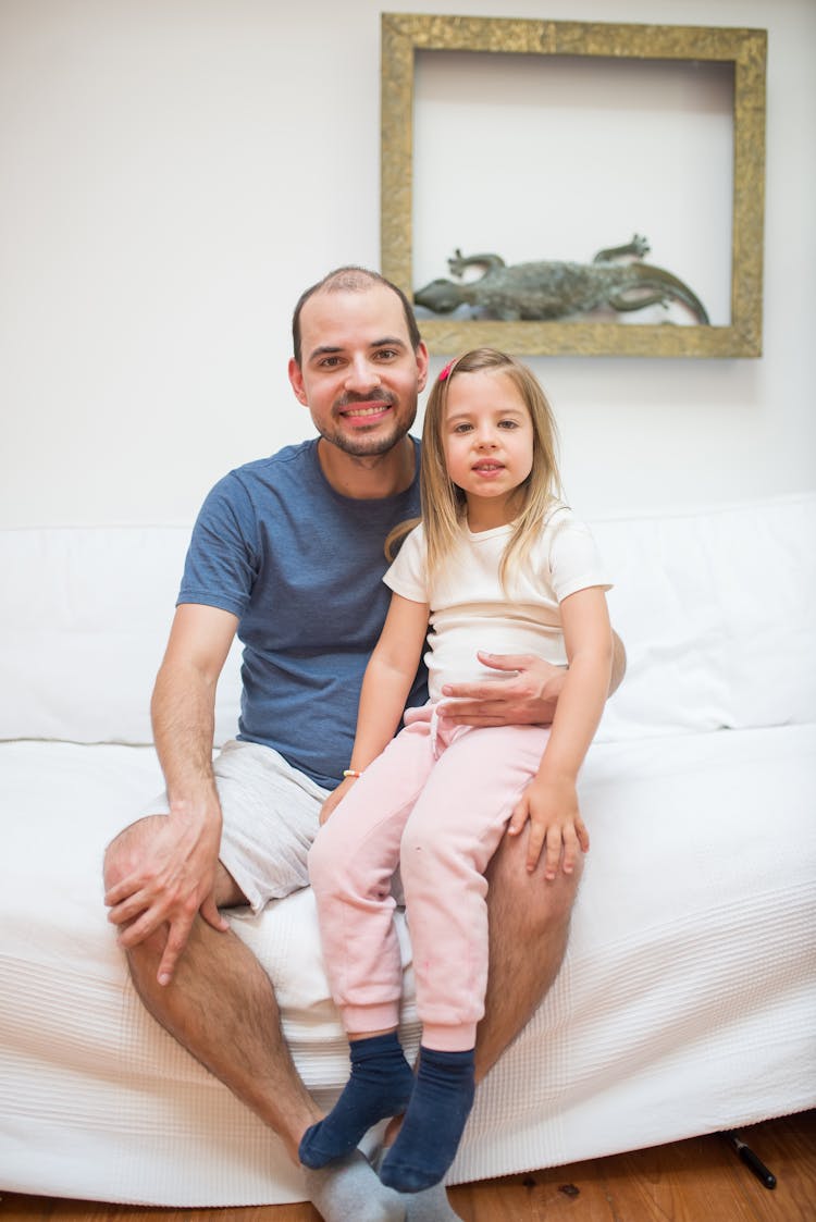 Child Sitting On Daddy's Lap