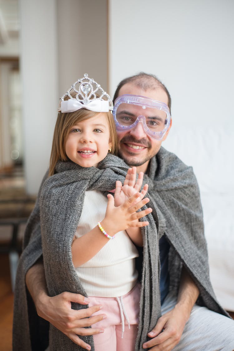 A Father And Daughter Playing Together