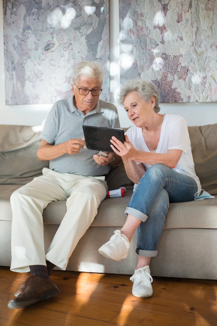 Elderly Couple Using A Tablet Together