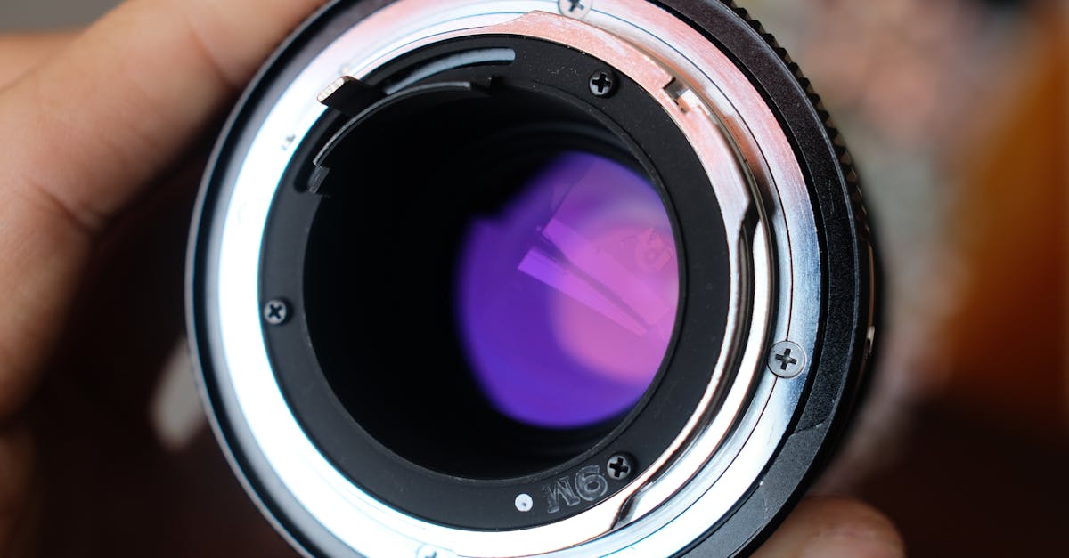 Camera lens mount showcasing the inner elements and purple coating, emphasizing optical quality and compatibility for high-end photography.