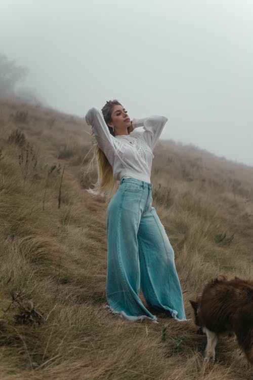 Woman Posing on Hill in Wide Leg Pants