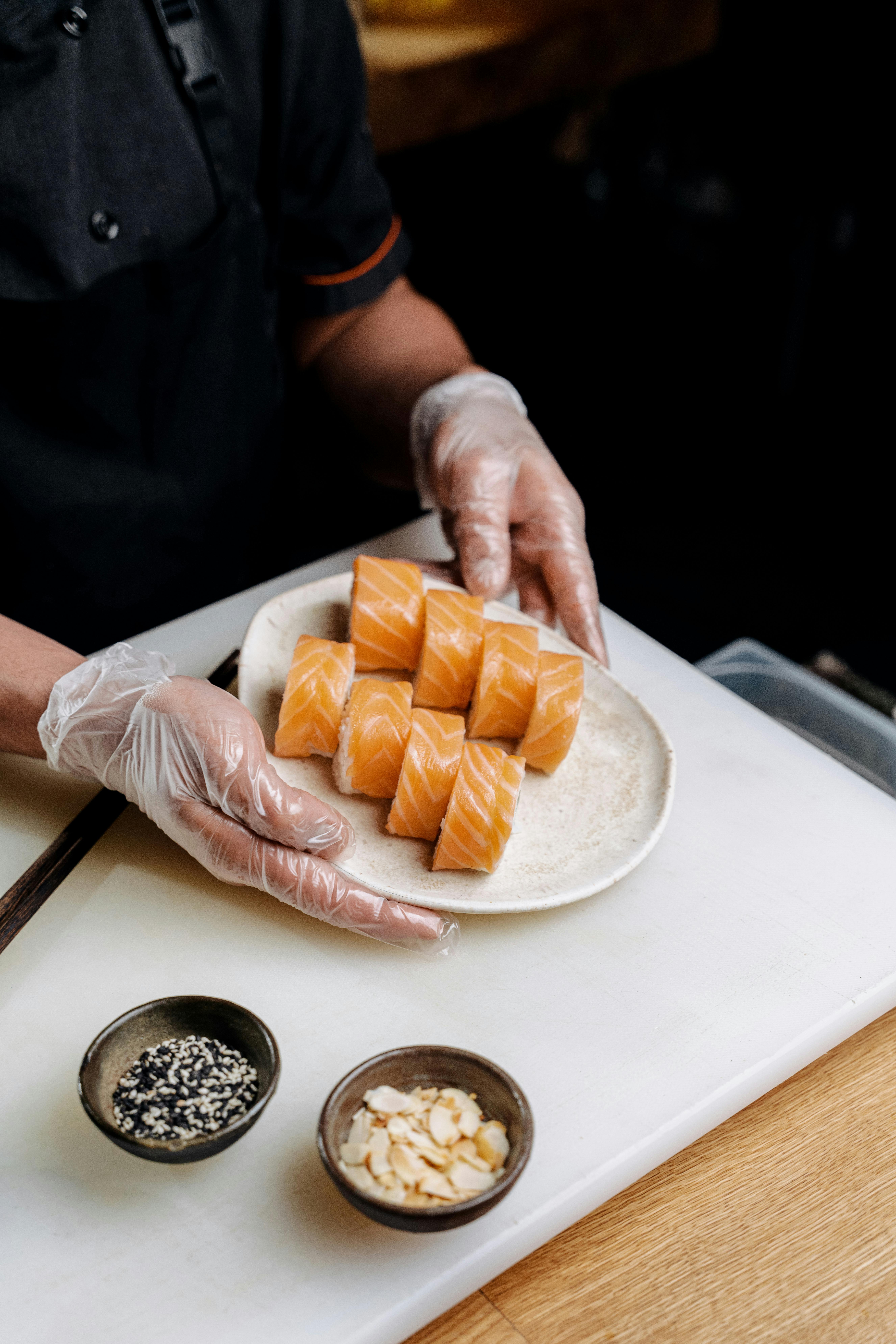 A close-up shot of a chef inside a campervan, preparing a dish with fresh ingredients.