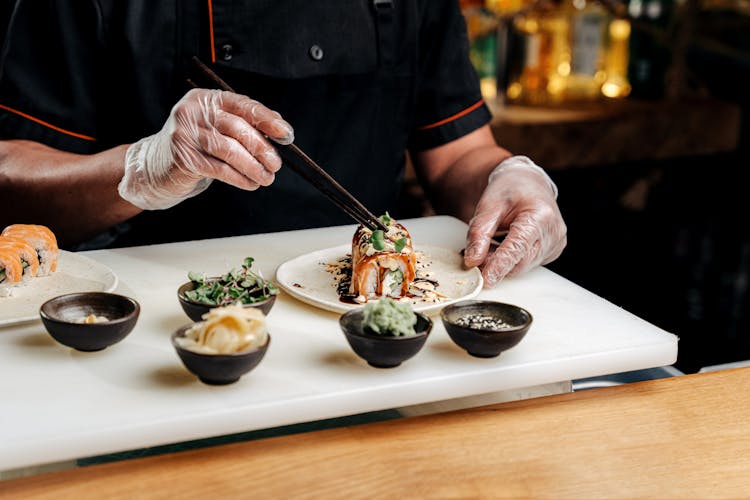 Chef Plating Sushi Rolls