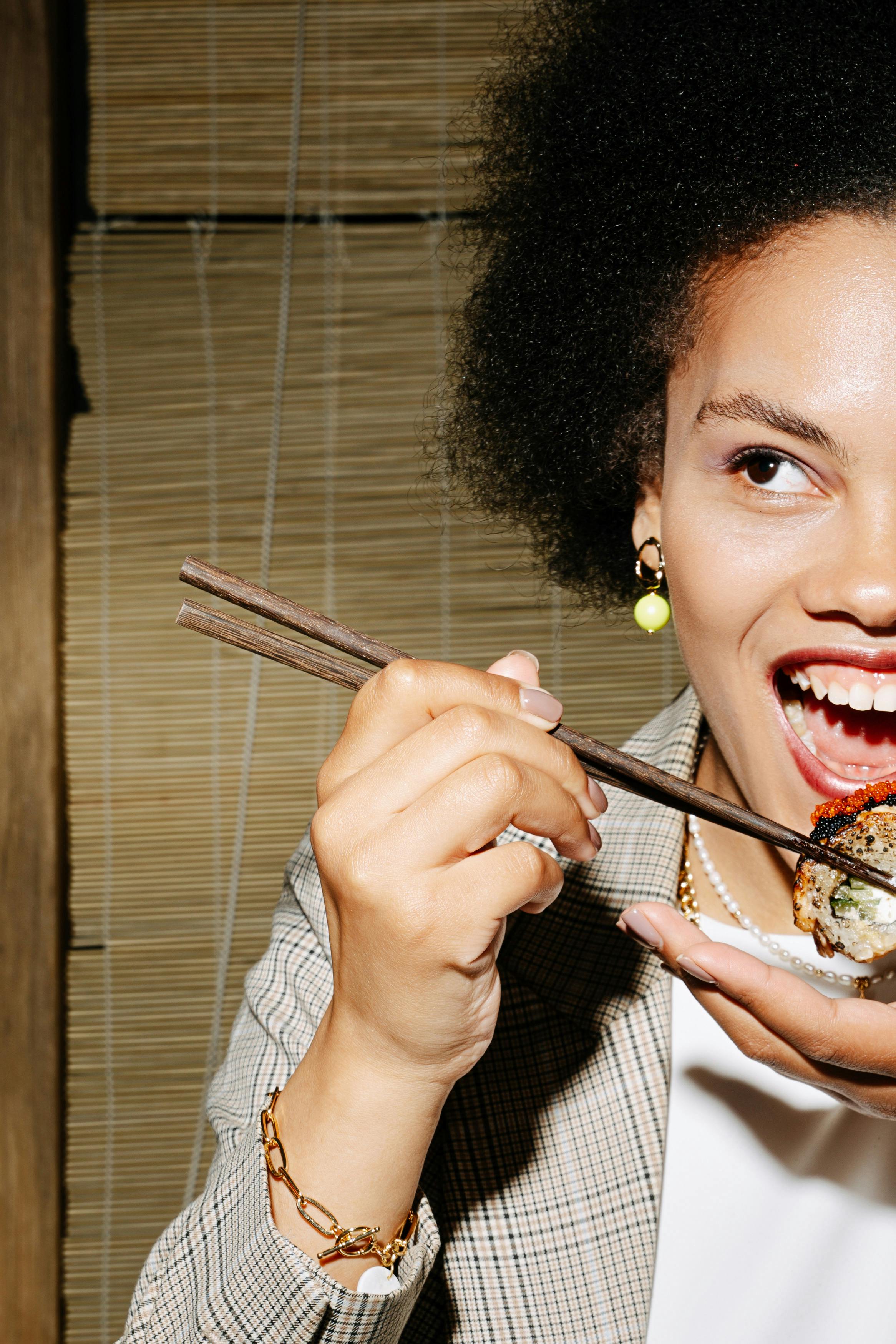 portrait of woman eating sushi