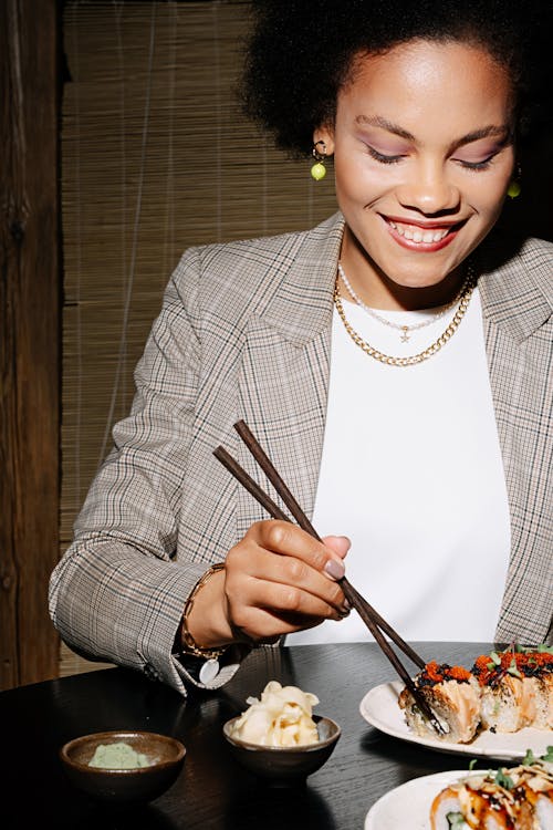 Smiling Woman Holding Chopsticks