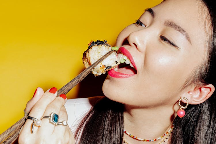 A Woman Eating Sushi