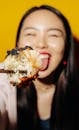 Woman Holding Sushi With Chopsticks