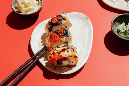 Free Sushi Rolls on Ceramic Plate Stock Photo