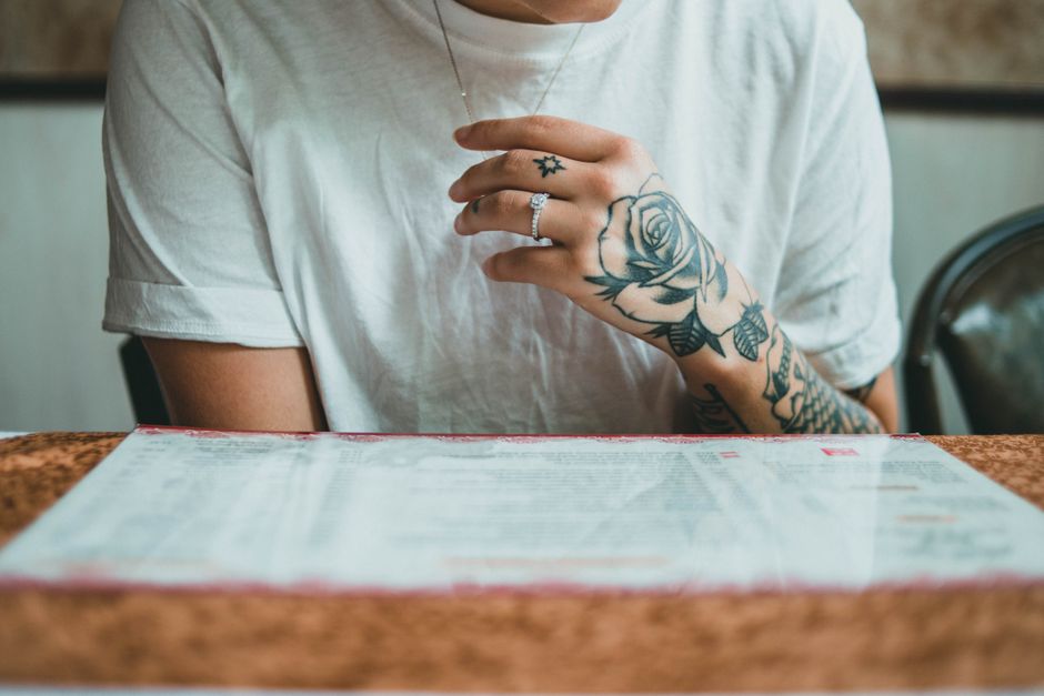 Detailed rose tattoo meaning shown on a forearm with fine-line shading Detailed rose tattoo meaning shown on a forearm with fine-line shading