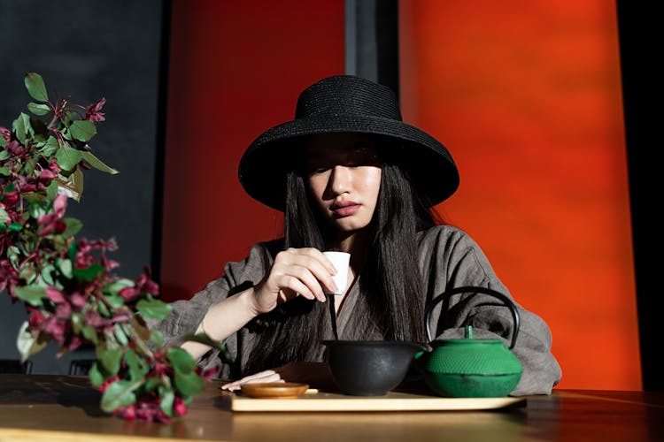 A Woman Holding A Teacup