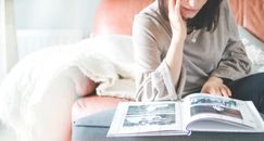 Woman Looking at Photo Album