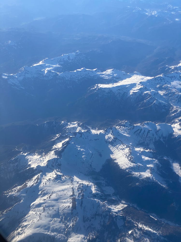 Snowy Mountains View From Plane Porthole