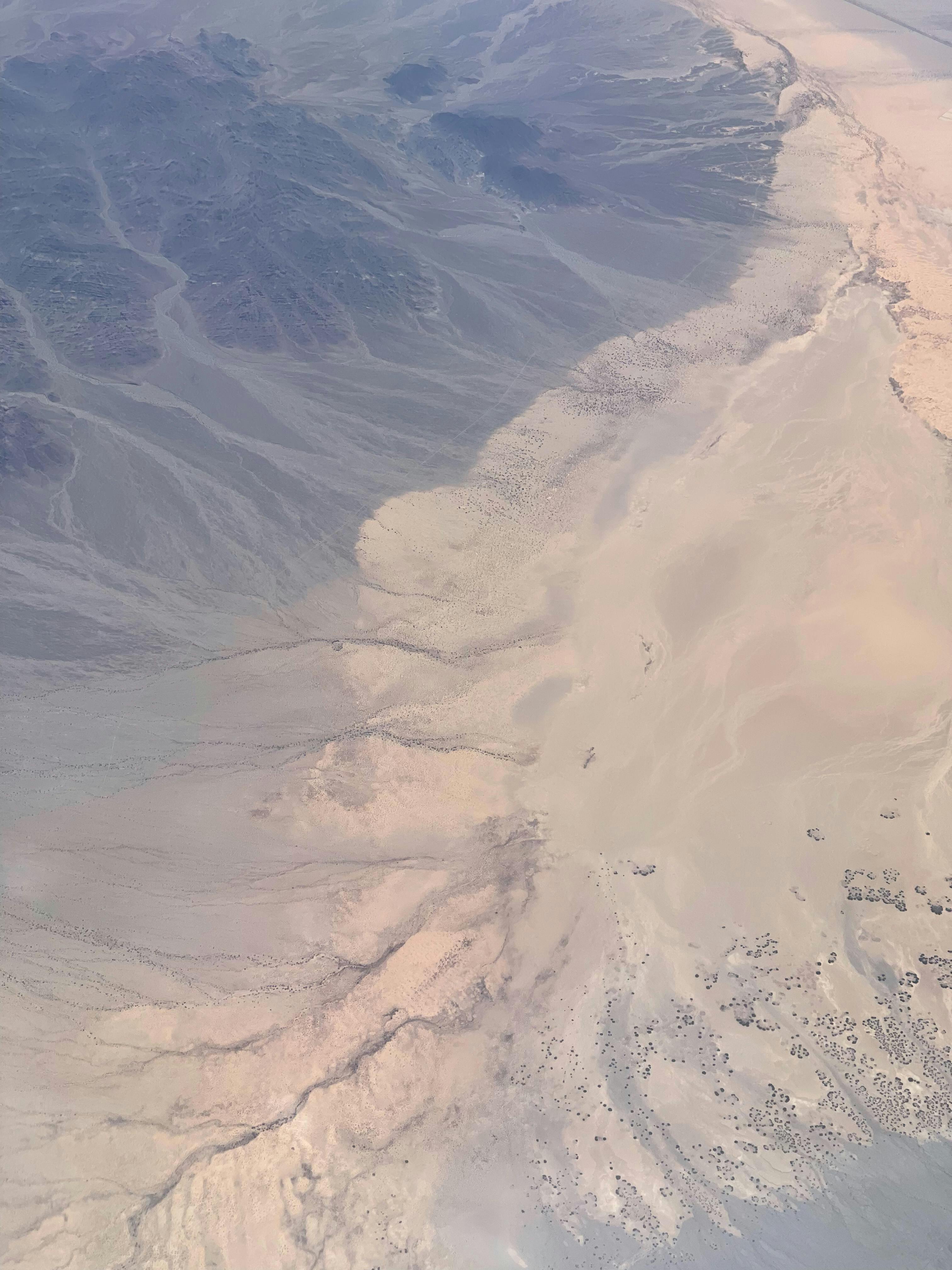 An accident scene with a police car and emergency lights on a highway