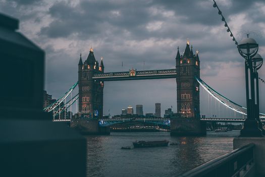 Capture of Tower Bridge at twilight in London, showcasing its architectural beauty over the Thames River.