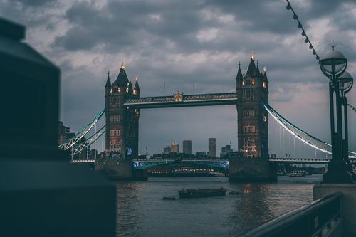 Free Capture of Tower Bridge at twilight in London, showcasing its architectural beauty over the Thames River. Stock Photo