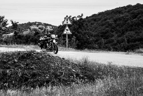 Free Grayscale Photo of Man Riding a Motorcycle Stock Photo