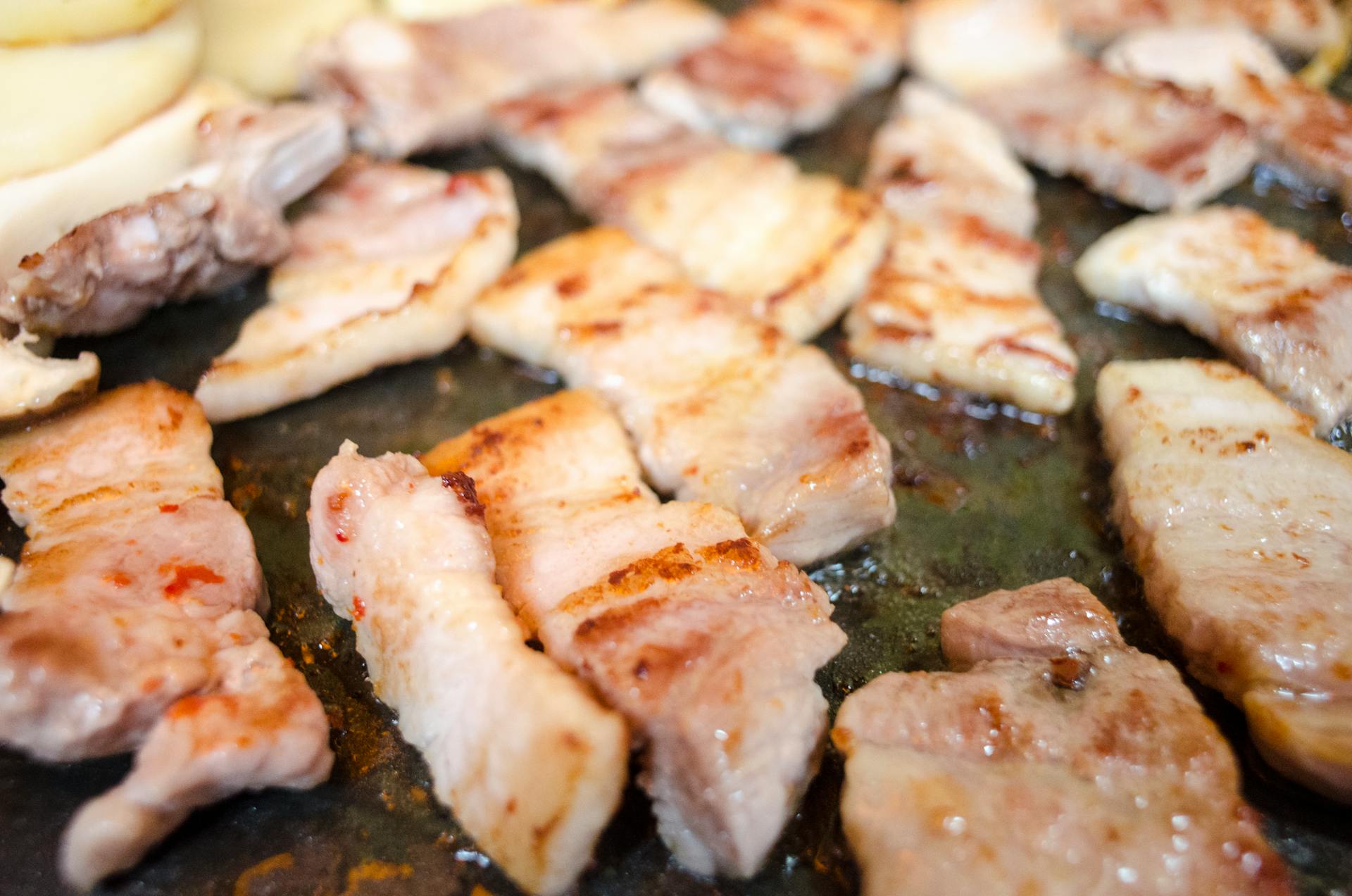 Close up of Bacon Pieces on a Grill