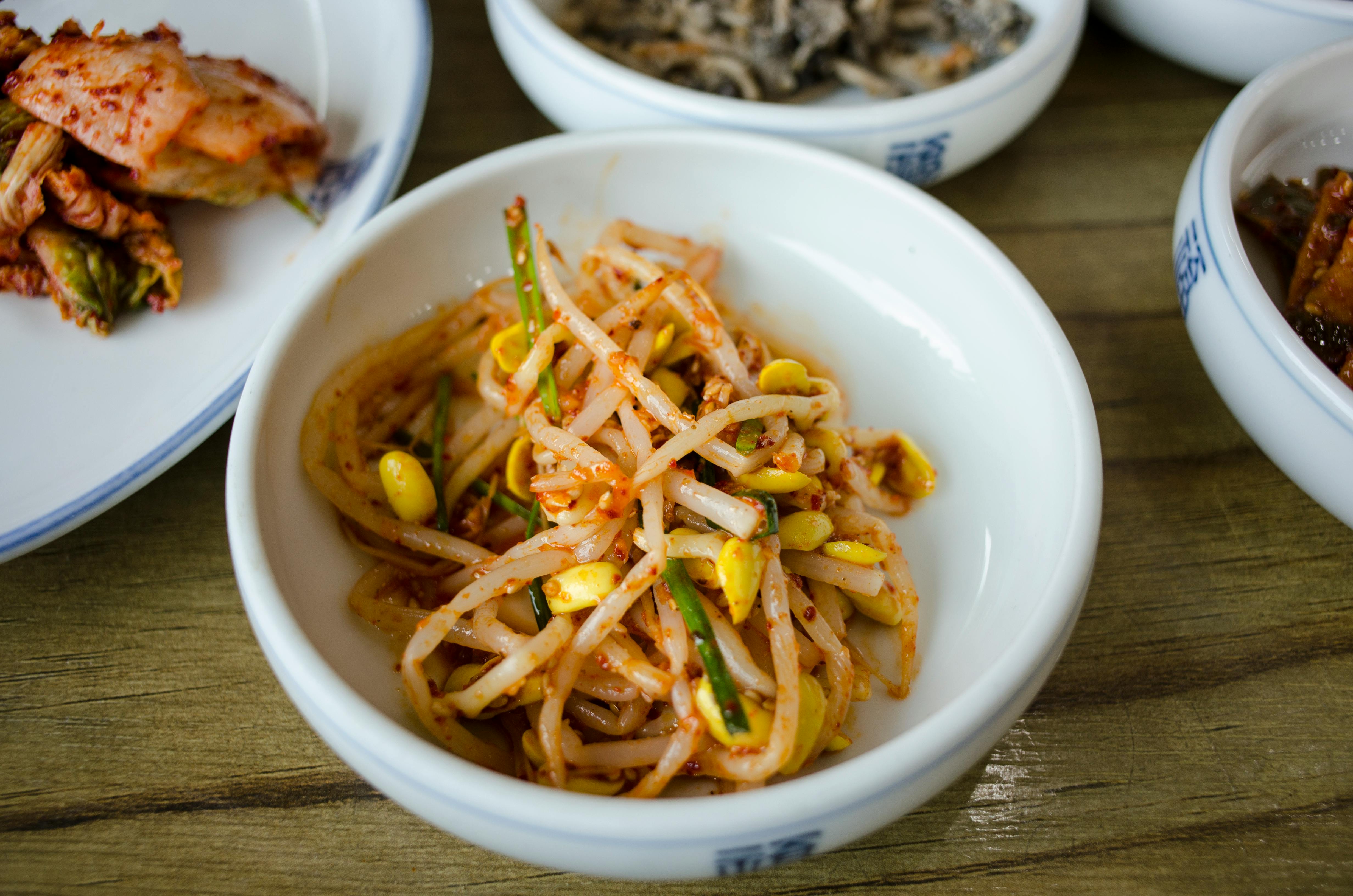 Korean Appetizers Served in a Restaurant · Free Stock Photo