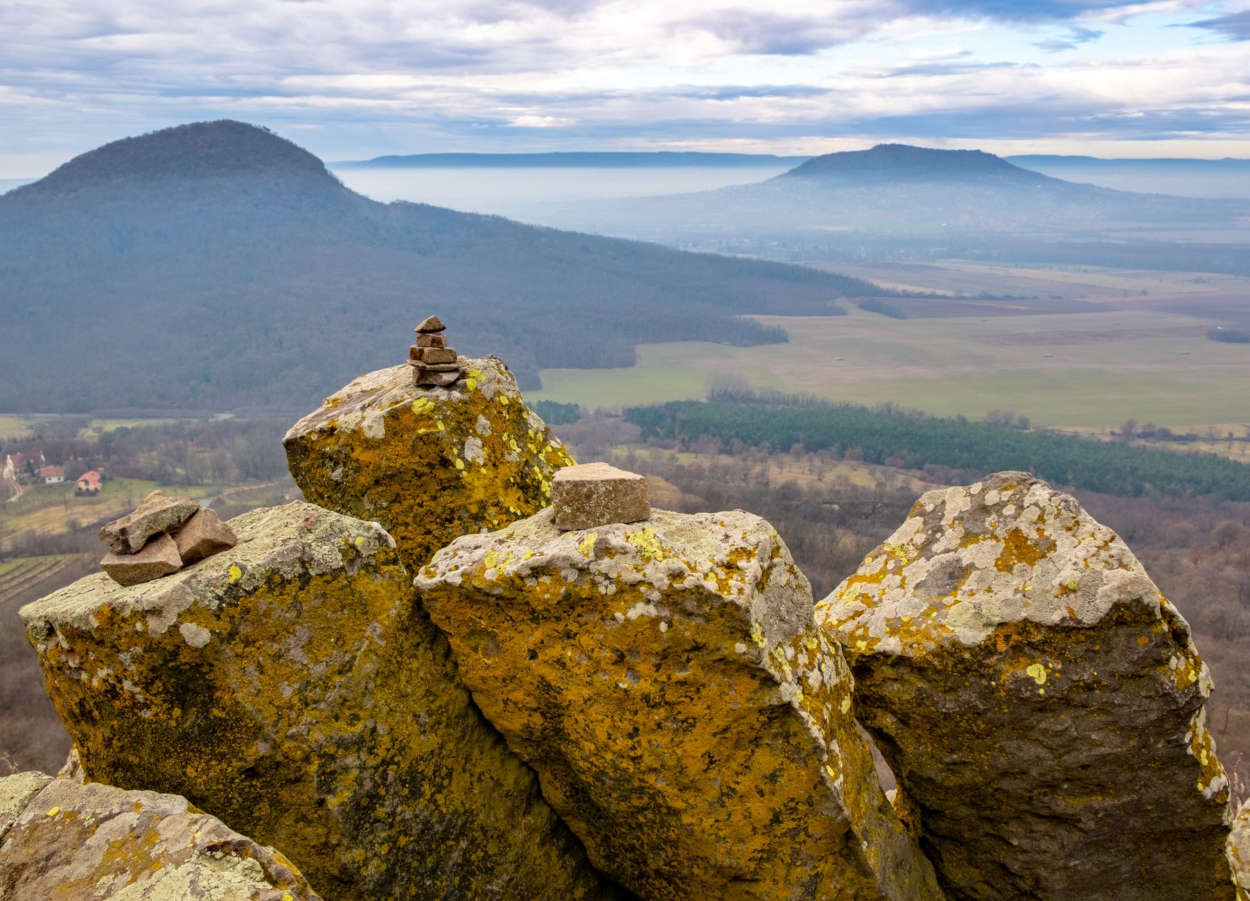 Scenic mountain landscape with rocks and hills in Hungary's countryside.