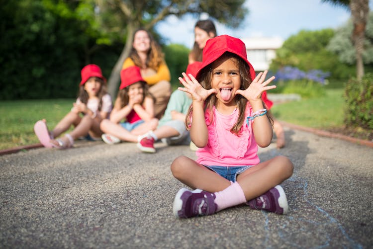 A Young Girl Showing Her Tongue