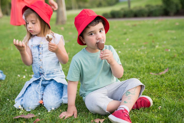 A Girl And Boy Eating Chocolate Ice Cream