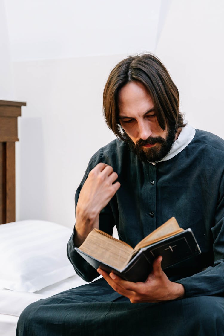 Man Reading A Bible 