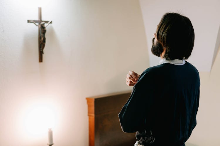 Religious Man Doing The Sign Of The Cross