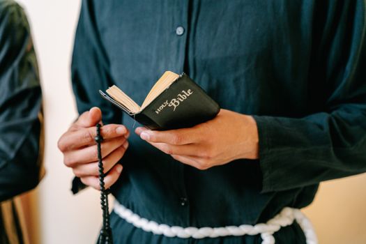Person Holding Black and White Book