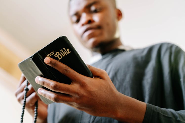 Man Wearing Black Soutane Praying