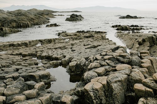 Безкоштовне стокове фото на тему «берег моря, вода, камінь»