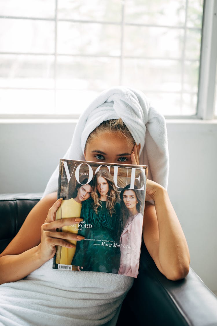 Woman Holding A Magazine