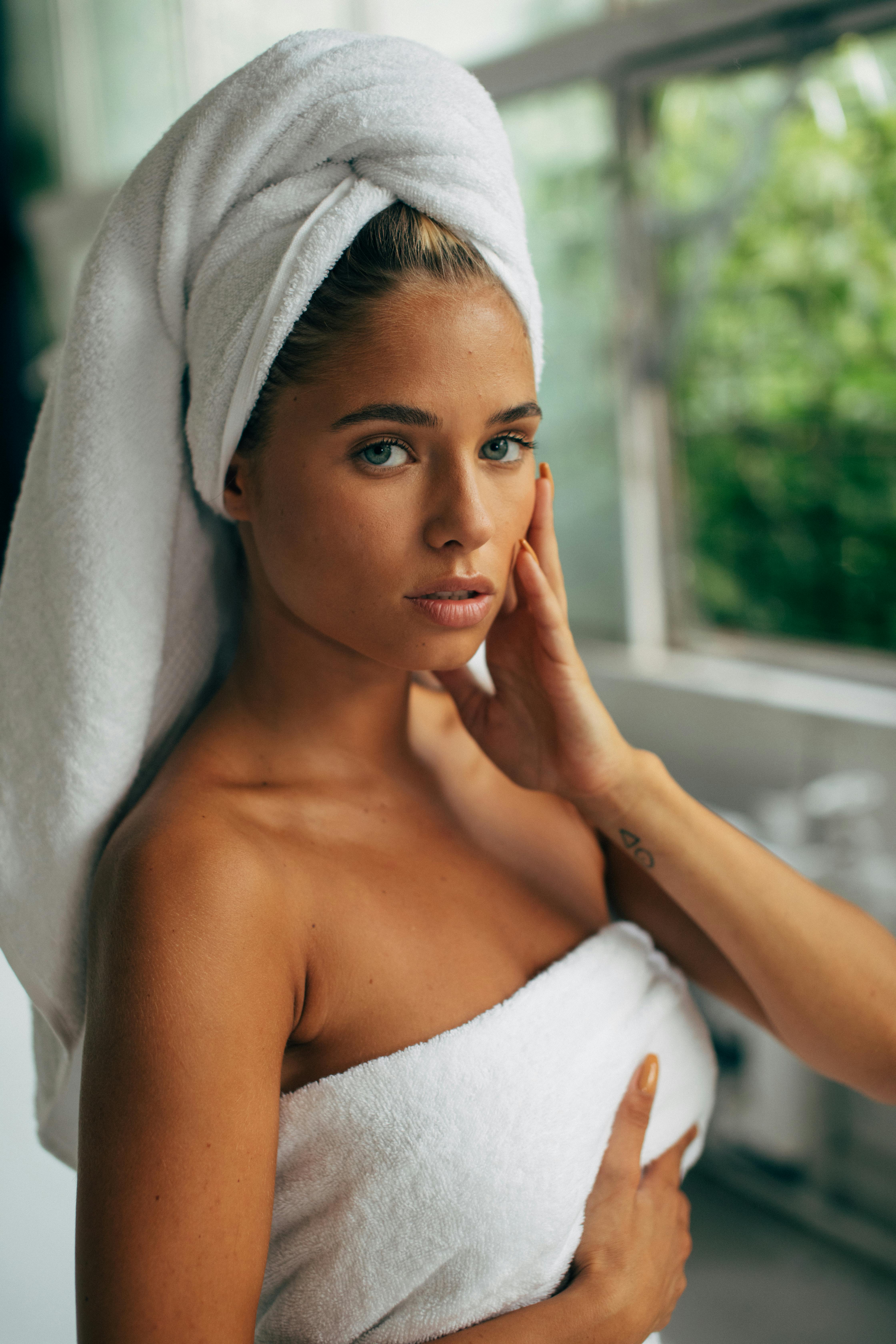 Woman in White Towel Covering Her Face