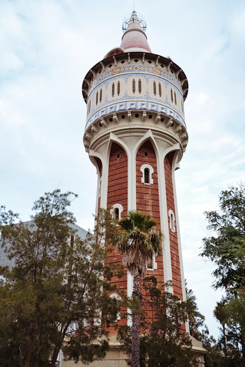 Free Low-Angle Shot of a Tower near Trees Stock Photo
