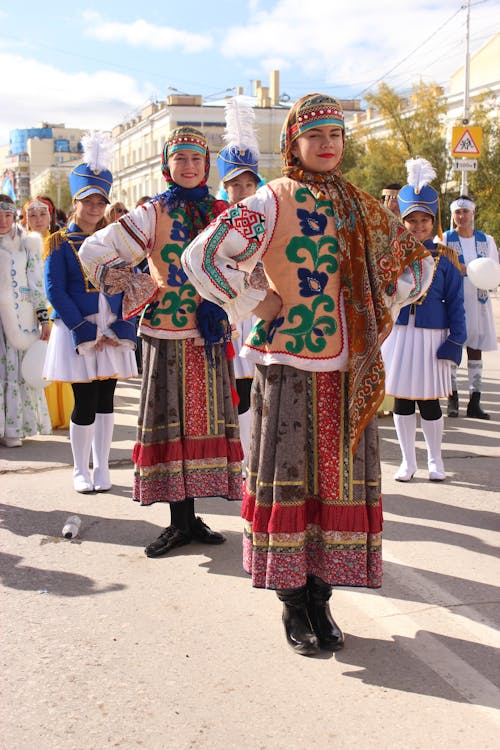 Women in Traditional Clothing on Street