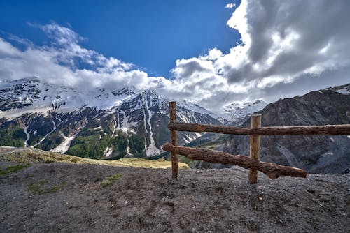 Brown Wooden Fence by a Cliff